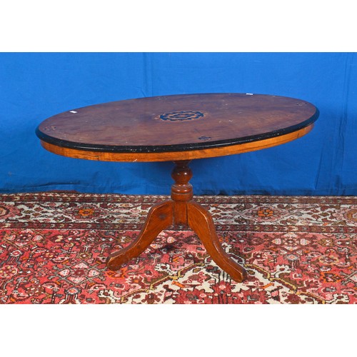 533 - A Victorian Oval inlaid Coffee Table & a Two Tiered Magazine Stand resting on Brass & Porcelain Cast... 