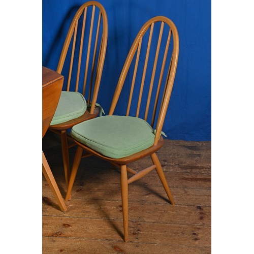 551 - An Ercol Drop Flap Table with Four Chairs.