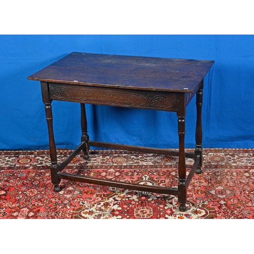 554 - An Antique Oak Chip Carved sided Side Table resting on turned legs, Cross Stretchers & Bun Feet. Mea... 