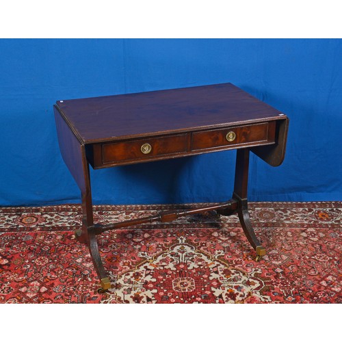 555 - A Mahogany Tow Drawers Drop end Sofa Table with turned under stretcher, Reeded legs & Brass Castors.... 