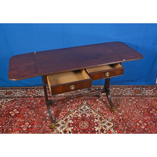 555 - A Mahogany Tow Drawers Drop end Sofa Table with turned under stretcher, Reeded legs & Brass Castors.... 