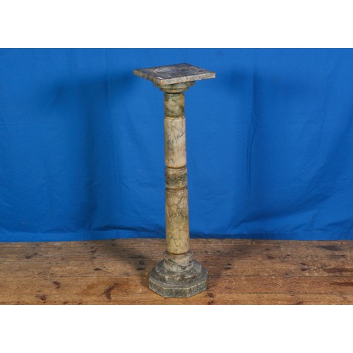 556 - An Italian Vert Marble Column of turned proportions. Measuring: 101cms high x 26cms across.