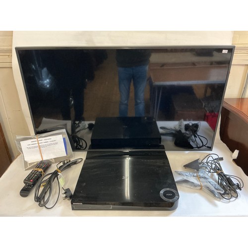 583 - A Samsung 42/43inch T.V. with a Samsung DVD Blu-Ray Player, Leads, Stand, Controllers, Instructions,... 