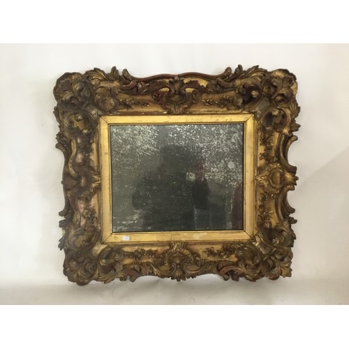 585 - A Louis XIV Style Gold, Wood & Gilded 19th Century Mirror. Measuring: 70cms x 62cms.