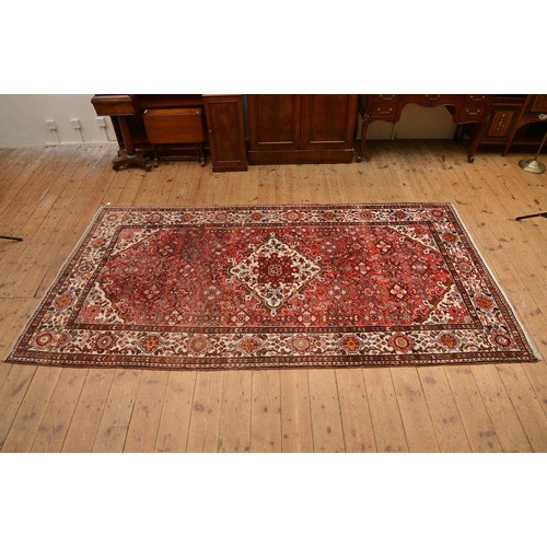 596 - A Pink Ground Central Medallion & Four Cornered Triple Floral Bordered Rug. Measuring: 325cms x 166c... 