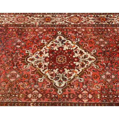 596 - A Pink Ground Central Medallion & Four Cornered Triple Floral Bordered Rug. Measuring: 325cms x 166c... 