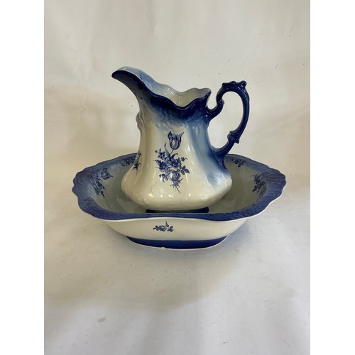 733 - A Blue Glazed Toilet Jug & Basin decorated with Flowers.