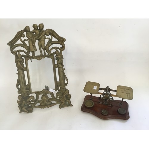 794 - A Brass Photo Frame depicting Children & Angels along with a Brass set of Letter Scales.