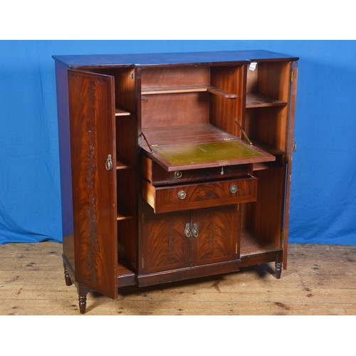 531 - A Cuban Flamed Mahogany Veneered Shaped Fronted Cocktail Cabinet fitted with Drawers & Cupboards. Me... 