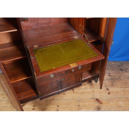 531 - A Cuban Flamed Mahogany Veneered Shaped Fronted Cocktail Cabinet fitted with Drawers & Cupboards. Me... 