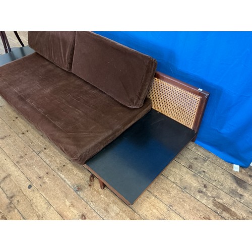 536 - A 1950s design Single Cane Backed Low Down Sofa with Tray Type Folding Ends resting on Turned Legs. ... 