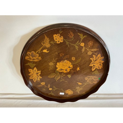 548 - A Circular Dutch design inlaid Tea Tray. Measuring: 38cms across.
