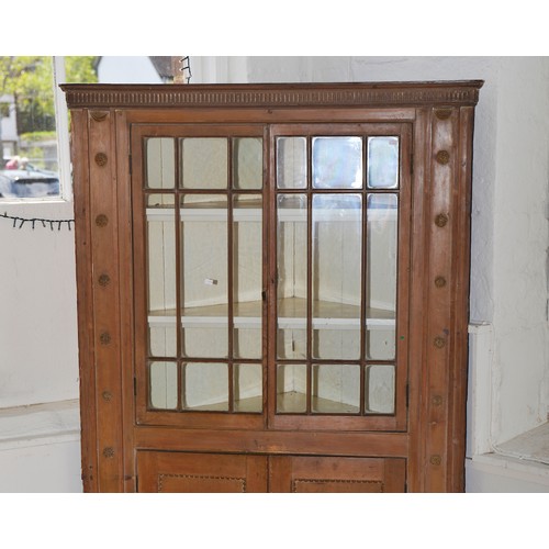 552 - A Victorian Pine Corner Cupboard in the Irish Taste decorated with Astragal Glazed Door & Floriette ... 