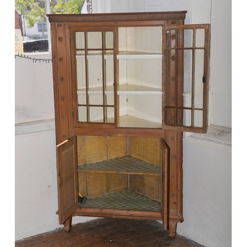 552 - A Victorian Pine Corner Cupboard in the Irish Taste decorated with Astragal Glazed Door & Floriette ... 