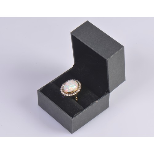 208 - A Stunning 18ct Ladies Oval Opal & Diamond Edged Colette set Dress Ring mounted with approximately 3... 