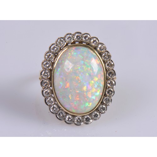208 - A Stunning 18ct Ladies Oval Opal & Diamond Edged Colette set Dress Ring mounted with approximately 3... 