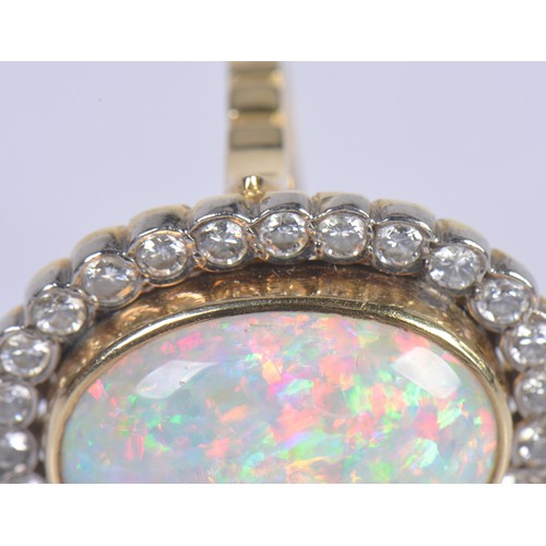 208 - A Stunning 18ct Ladies Oval Opal & Diamond Edged Colette set Dress Ring mounted with approximately 3... 