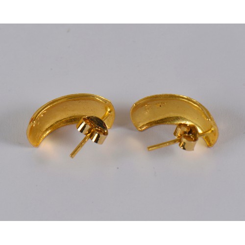 10 - A pair of half hoop engraved earrings, in a high carat gold.