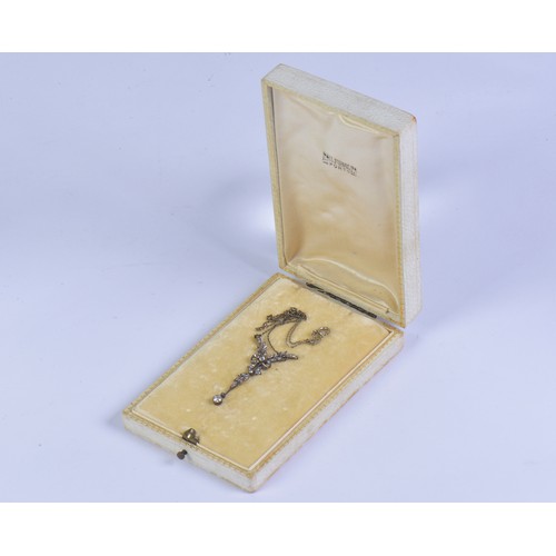 27 - An Edwardian diamond necklace featuring a delicate leaf and bow design, set with diamonds, the large... 