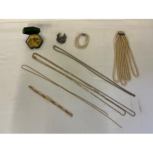 175 - A varied collection of costume jewellery, comprising a costume pearl necklace and matching bracelet,... 
