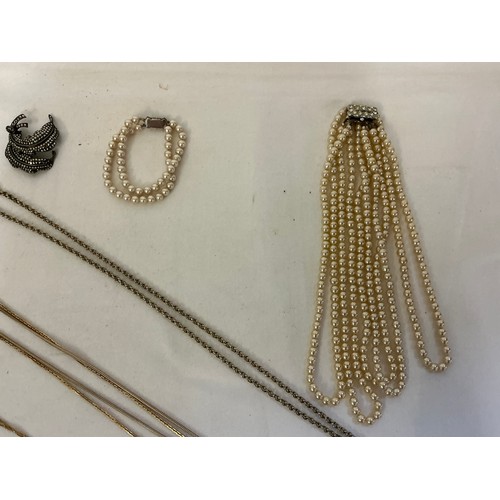 175 - A varied collection of costume jewellery, comprising a costume pearl necklace and matching bracelet,... 