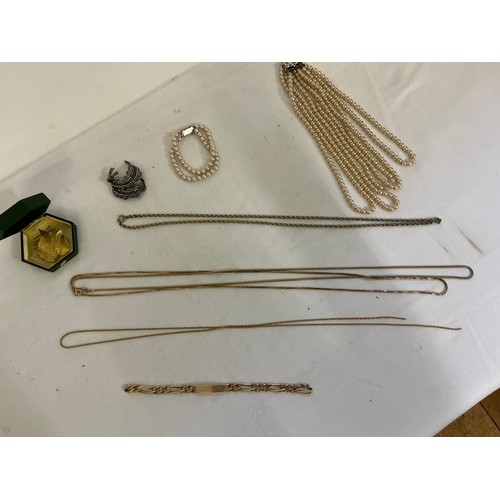 175 - A varied collection of costume jewellery, comprising a costume pearl necklace and matching bracelet,... 