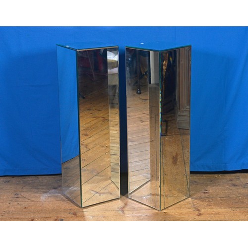 645 - A Pair of Glass Mirrored Modernistic design Statue Columns. Measuring: 28cms Square x 101cms high.