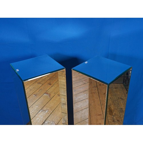 645 - A Pair of Glass Mirrored Modernistic design Statue Columns. Measuring: 28cms Square x 101cms high.