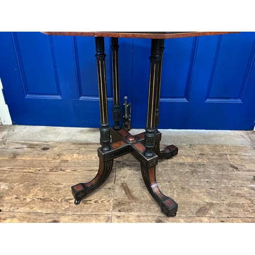 650 - A Victorian Amboyna Wood Inlaid & Ebonised Octangle Top Drawing Room Table resting on Swept out quad... 