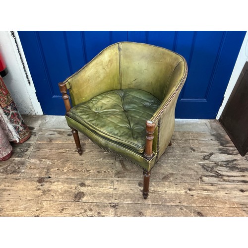 651 - A Mahogany Framed Green Leather & Studied Hoop Back chair resting on turned Legs.