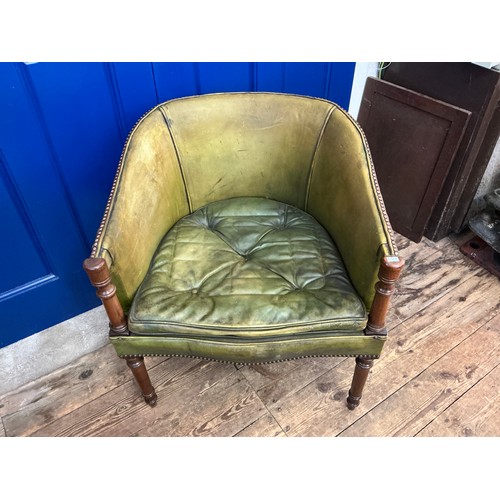 651 - A Mahogany Framed Green Leather & Studied Hoop Back chair resting on turned Legs.