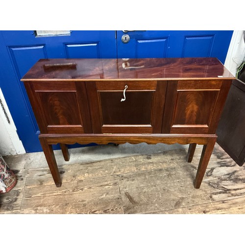 654 - A Cuban Mahogany Veneered Drop-Flap Gentleman's Club Cabinet in a Flame Veneer with a Drop Down Flap... 
