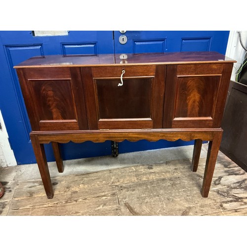 654 - A Cuban Mahogany Veneered Drop-Flap Gentleman's Club Cabinet in a Flame Veneer with a Drop Down Flap... 