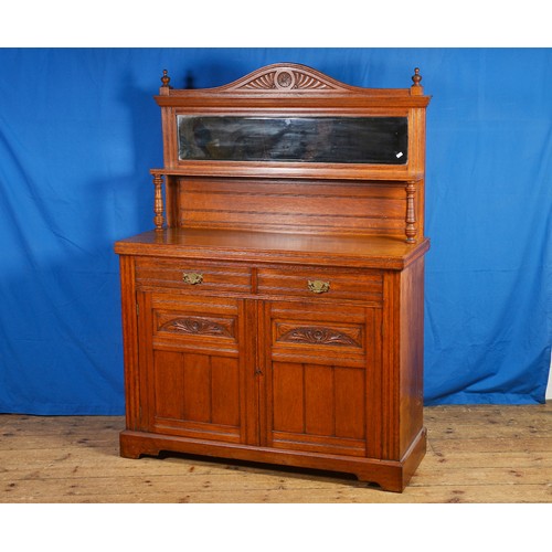 668 - An Edwardian Oak Chiffonier with a Mirror Back, Turned Columns, Two Drawers & Cupboards Below. Measu... 