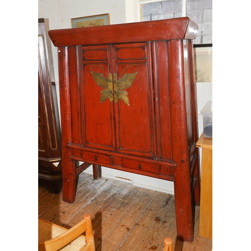669 - A Chinese Red Lacquered & Metal mounted Food Cabinet fitted two drawers & resting on shaped legs. Me... 