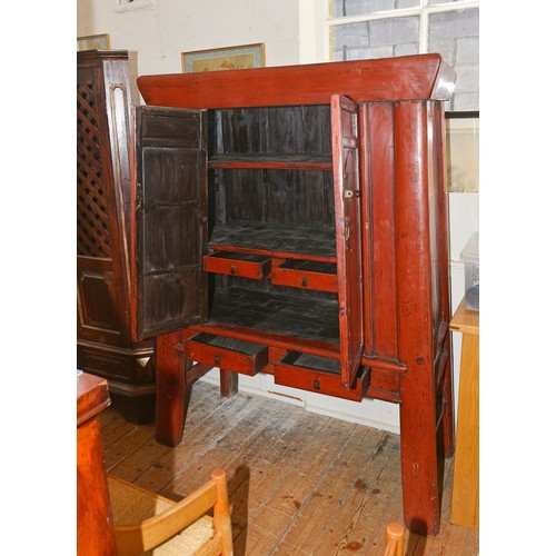 669 - A Chinese Red Lacquered & Metal mounted Food Cabinet fitted two drawers & resting on shaped legs. Me... 