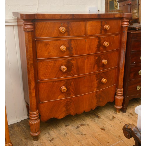 672 - A North Country Cuban Flame Veneered Bow Fronted & Pillared Chest of Drawers. Measuring: 130cms acro... 