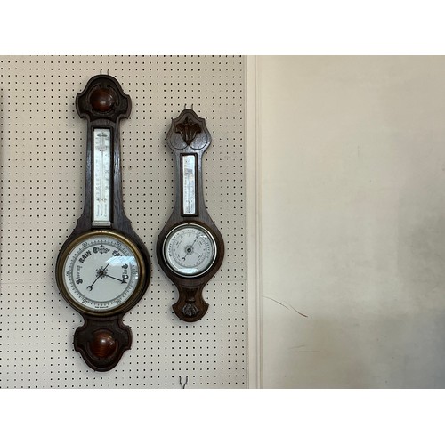 674 - A 1920s Oak Cased Barometer/Thermometer & one other.