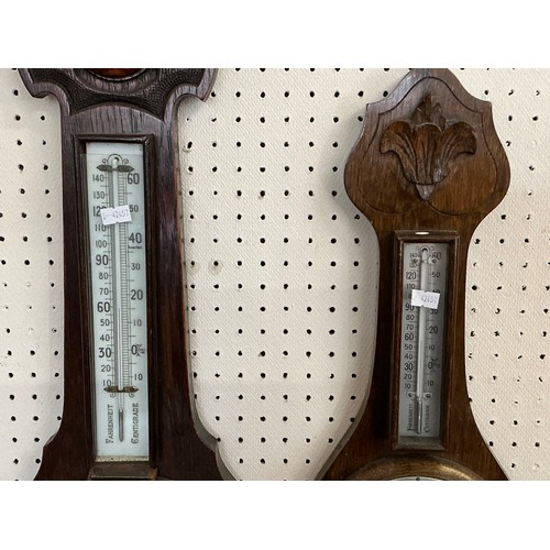 674 - A 1920s Oak Cased Barometer/Thermometer & one other.