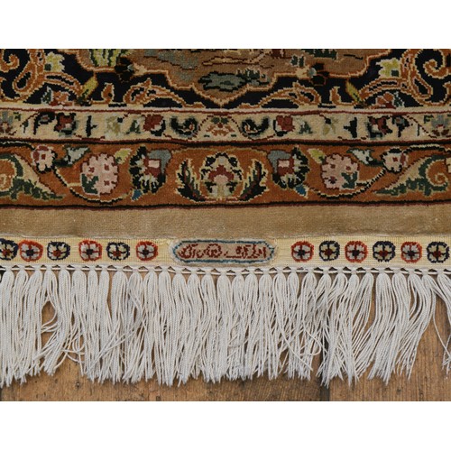 676 - A Superb Qum Silk Rug in a pale Cream with a Central Medallion Panel of a Temple with hanging Flower... 