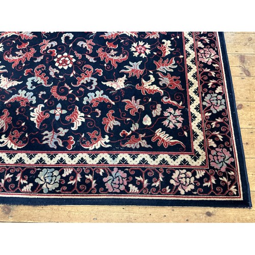 678 - A Louis de Poortere/Mossoul Blue & Beige Rug. Measuring: 350cms x 200cms.