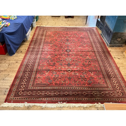 679 - A Large Louis de Poortere/Mossoul Red & Beige Ground Rug. Measuring: 373cms x 275cms. XXX