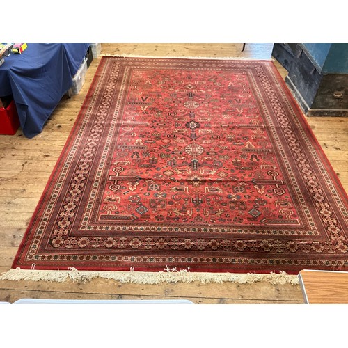 679 - A Large Louis de Poortere/Mossoul Red & Beige Ground Rug. Measuring: 373cms x 275cms. XXX
