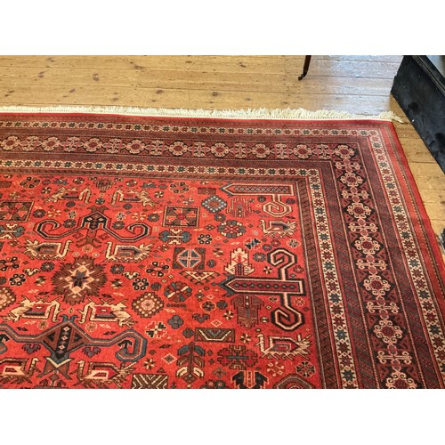 679 - A Large Louis de Poortere/Mossoul Red & Beige Ground Rug. Measuring: 373cms x 275cms. XXX