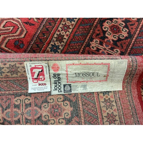 679 - A Large Louis de Poortere/Mossoul Red & Beige Ground Rug. Measuring: 373cms x 275cms. XXX