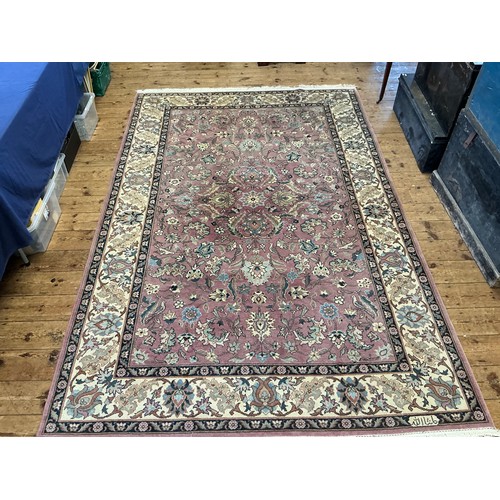 682 - A Light Burgundy Ground All Over Floral patterned Beige Bordered & Deep Blue Sided Persian Rug, Sign... 