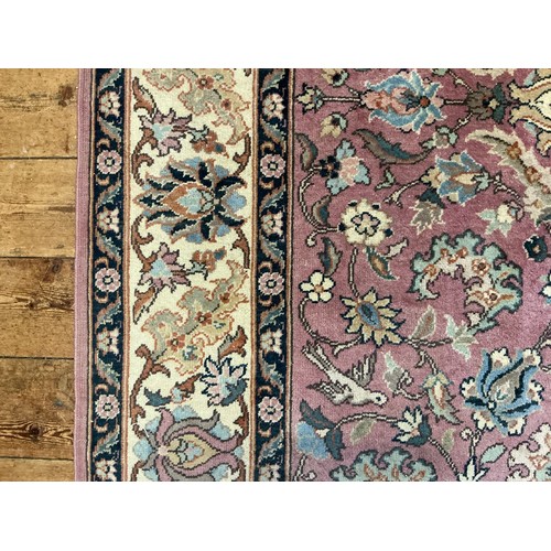 682 - A Light Burgundy Ground All Over Floral patterned Beige Bordered & Deep Blue Sided Persian Rug, Sign... 