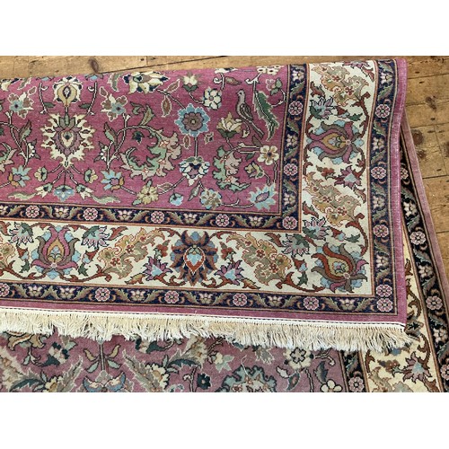 682 - A Light Burgundy Ground All Over Floral patterned Beige Bordered & Deep Blue Sided Persian Rug, Sign... 