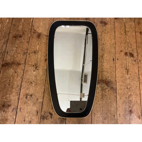 685 - A Gold Framed Retro Mirror. Measuring: 38cms x 73cms.