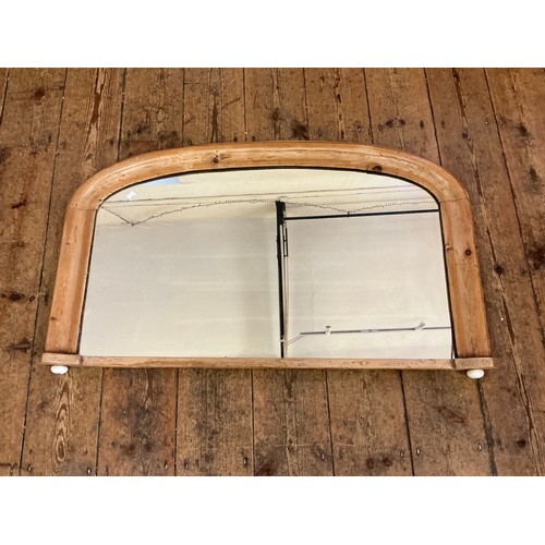 687 - A Pine Framed Over Mantle Mirror of Curved Form. Measuring: 97cms x 53cms.
